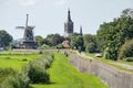 Hasselt windmill, church and seadike Royalty Free Stock Photo