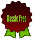 HASSLE FREE on red seal with green ribbons.