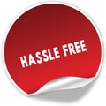 HASSLE FREE text on realistic red sticker on white background.