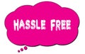 HASSLE FREE text written on a pink thought bubble