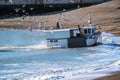 Hastings, East Sussex, England. A fishing boat returns with the catch of the day