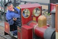 HASTINGS, UK - JULY 23, 2017: Close-up on the driver of a steam train at the Hastings Miniature Railway located at Rock-a-Nore Roa