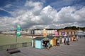 HASTINGS, UK - JULY 23, 2017: View of the seafront from the Pier rebuilt and open to public in 2016 with colorful huts in the fo