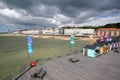 HASTINGS, UK - JULY 23, 2017: View of the seafront from the Pier rebuilt and open to public in 2016 with colorful huts in the fo