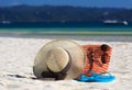 Hat, bag, sun glasses and flip flops on tropical beach Royalty Free Stock Photo