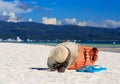 Hat, bag, sun glasses and flip flops on tropical beach Royalty Free Stock Photo