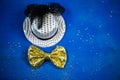 Hat and bow tie, blue background, party, carnival, New Year`s Ev Royalty Free Stock Photo