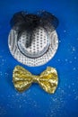 Hat and bow tie, blue background, party, carnival, New Year`s Royalty Free Stock Photo