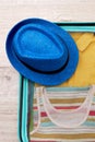 Hat, packed suitcase for trip. Royalty Free Stock Photo