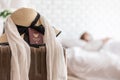 Hat and Passport on lugguage with sick woman wearing face protection mask lying on bed has fever by corona virus 2019 Royalty Free Stock Photo