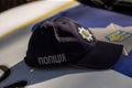 Hat of the ukrainian policeman with sign Police in ukrainian laguage and logo of police department