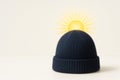 A hat with the rising sun on a light background. Space for text. Royalty Free Stock Photo