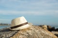 Hat on the rock at the beach Royalty Free Stock Photo