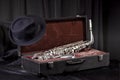 Hat and saxophone in an old suitcase Royalty Free Stock Photo