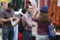 A hat seller selling top hats in Spitalfield Market Spitalfields East London England