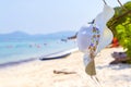 Hat And sunglasses lying on tropical sand beach Sunglasses on the beach. Beautiful sea view wallpaper, background Enjoyed a relaxi Royalty Free Stock Photo