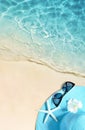 Hat and sunglasses on the sandy beach. Summer background Royalty Free Stock Photo