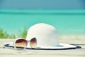 Hat and sunglasses on the wooden jetty Royalty Free Stock Photo