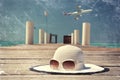 Hat and sunglasses on the wooden jetty. Royalty Free Stock Photo