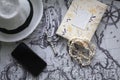 Hat, watch, book, shell braÃÂelet, telephone on the map of the world Royalty Free Stock Photo