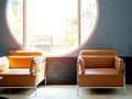 Modern orange leather sofa on blue background with round window Royalty Free Stock Photo