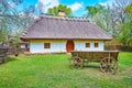 The hata house and old wooden cart in Potter`s estate, Mamajeva Sloboda Cossack Village, Kyiv, Ukraine Royalty Free Stock Photo