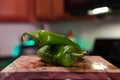 Hatch green Chile pile for display in the kitchen Royalty Free Stock Photo