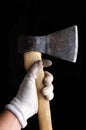 Hatchet ax in hand isolated on black background Royalty Free Stock Photo