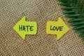 Hate or Love write on sticky notes isolated on Wooden Table Royalty Free Stock Photo