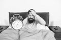 Hate this noise. Problem with early morning awakening. Get up early. Tips for waking up early. Man bearded hipster Royalty Free Stock Photo