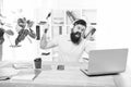 Hate office routine. Man bearded guy headphones office swing hammer on computer. Slow internet connection. Outdated Royalty Free Stock Photo