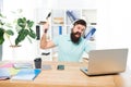 Hate office routine. Man bearded guy headphones office swing hammer on computer. Slow internet connection. Outdated Royalty Free Stock Photo