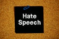 Hate Speech text message on stick note on cork paper background Royalty Free Stock Photo