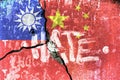 Hate text on concrete wall with the Taiwanese and chinese flag. Conflict concept. Royalty Free Stock Photo
