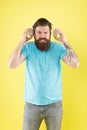 Hateful song. Music taste. Bearded guy dislike music. Irritating sound. Man listening music wireless headphones Royalty Free Stock Photo