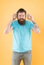 Hateful song. Music taste. Bearded guy dislike music. Irritating sound. Man listening music wireless headphones Royalty Free Stock Photo