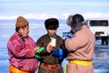 Hatgal, Mongolia, Febrary 23, 2018: mongolian people dressed in traditional clothing on a frozen lake Khuvsgul and