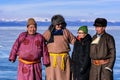 Hatgal, Mongolia, Febrary 23, 2018: mongolian people dressed in traditional clothing on a frozen lake Khuvsgul