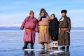 Hatgal, Mongolia, Febrary 23, 2018: mongolian people dressed in traditional clothing on a frozen lake Khuvsgul