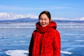 Hatgal, Mongolia, Febrary 23, 2018: mongolian young girl portrait on a frozen lake Khuvsgul