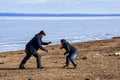 Hatgal, Mongolia, Febrary 25, 2018: two men playing outside in Mongolian wrestling