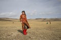 Young mongolian girl in a steppe