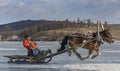 Mongolian people riding a sledge on a frozen lake Khuvsgul