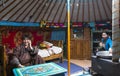 Young mongolian nomad family in their home ger yurt
