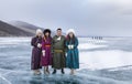 Young mongolian people on a frozen lake