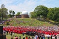 Hats are thrown in the air at outdoor Wesleyan University Graduation Middletown Conneticut USA circa May 2015