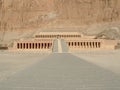 The huge and impressive Hatshepsut Temple with stone cliff behind 