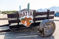 Hatta, UAE, 10.11.2020. Old wooden cart with Hatta logo at the entrance to Hatta Wadi Hub, United Arab Emirates