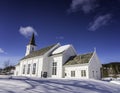 Hattfjelldal Church, Norway. Very sunny day, much snow, very deep blue sky and almost no clouds, side view