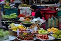 Lady sells fresh fruit & vegetables at street market bazaar Hatyai Thailand